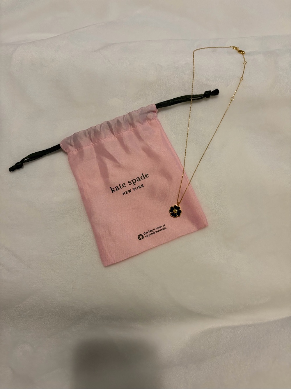 Kate Spade gold chain necklace with black clover pendant